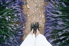 POV Shot From Above On Woman Feet In Brown Leather Vintage Boots And White Traditional Dress Stand On Path Or Trail In Lavender Field Between Beautiful Purple Flowers,inspirational Exploring Blog Post