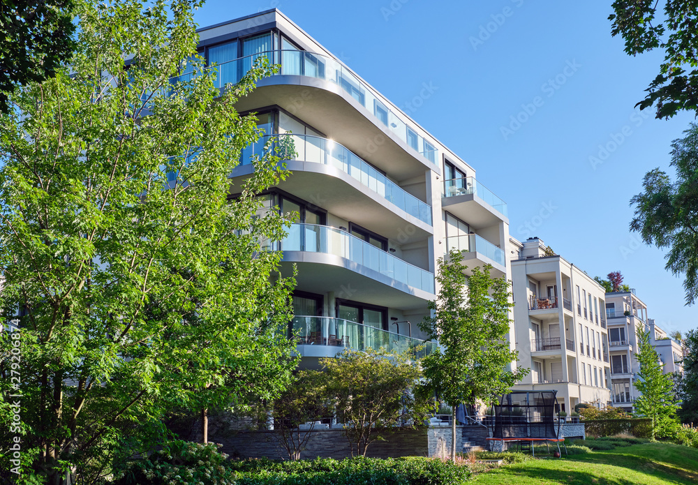 Modern apartment house with a green garden seen in Berlin, Germany - obrazy, fototapety, plakaty 