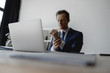 © Yakobchuk Olena - Selective focus of the laptop and man touching his wrist