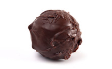 Dark Chocolate Truffles Filled With Caramel On A White Backgroun