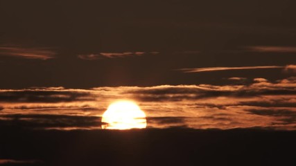 Wall Mural - Sunrise Close Up On Warm Lit Cloudy Sky