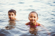 © Cavan for Adobe - Portrait of children swimming in lake