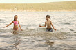 © Cavan for Adobe - Friends (8-9) having fun in river