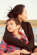 © Cavan for Adobe - Mom with son (8-9) on boat
