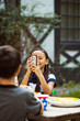 © Cavan for Adobe - Friends taking pictures at table