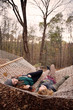© Cavan for Adobe - Young women relaxing in hammock