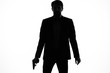 © SHOTPRIME STUDIO - silhouette of man in suit and tie