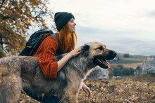 Woman With Dog In Autumn Park