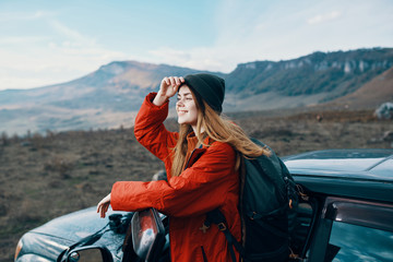 woman with backpack in mountains