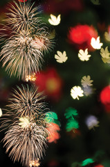 Wall Mural - colorful firework and bokeh with copy space for merry christmas and new year celebration background