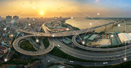 Wall Mural - Smart city and wireless communication network concept. Digital network connection lines of Hanoi city at Vinh Tuy bridge