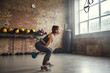 © Friends Stock - Woman exercising in gym
