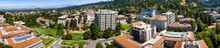 Panoramic View Of The University Of California, Berkeley Campus On A Sunny Day, View Towards Richmond And The San Francisco Bay Shoreline In The Background, California