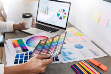Wall Mural - creative businessman graphic designer do his work at desk consulting and business planning.
