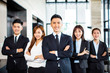 © Tom Wang - confident asian business team stands in office