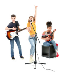 Wall Mural - Teenage musicians playing against white background