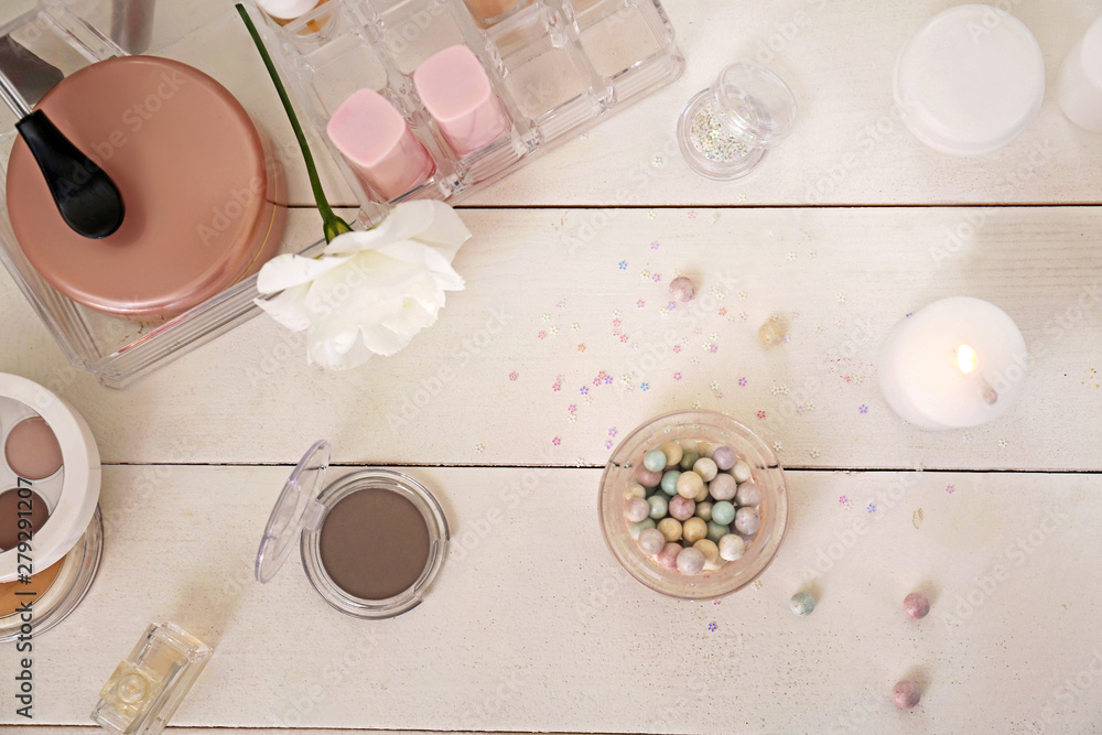 Makeup cosmetics on white dressing table