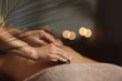 canvas print picture - Beautiful young woman undergoing treatment with hot stones in spa salon