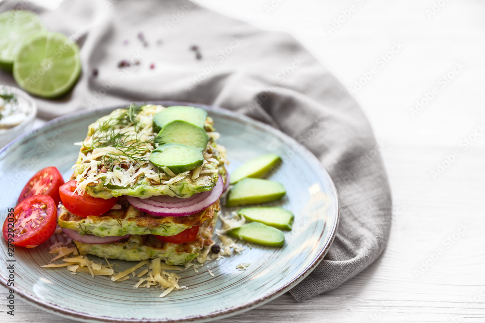 Plate with tasty squash waffles on white table