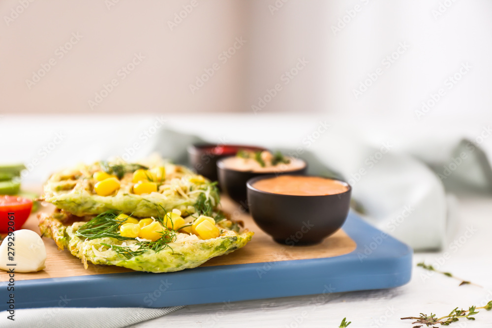 Tasty squash waffles and sauces on board