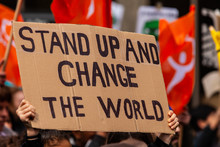 Homemade Sign At Environmental Rally. A Cardboard Sign Is Seen Close Up, Saying Stand Up And Change The World, As Eco-activists March For The Environment On A Street In Montreal, Canada