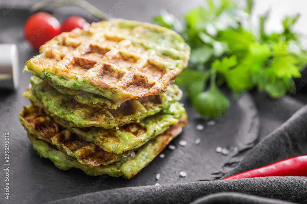 Tasty squash waffles on slate plate, closeup