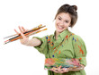 Girl painter holding brushes and palette with oil paints and happy smiling,  professional painter at work over white bacground