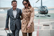 © Nejron Photo - Young business couple near private helicopter
