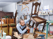 © JackF - Carpenter repairing antique chair