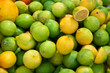 Oranges, lemons and limes in outdoor market. Ripe spanish citrus fruits.