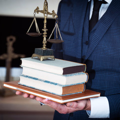 Canvas Print - Lawyer businessman working or reading lawbook in office workplace for consultant lawyer concept.