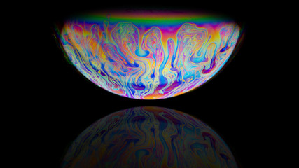 abstract colorful planet on black background