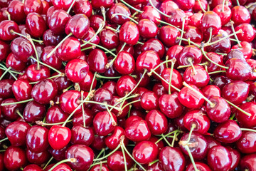 Canvas Print - Cherries pile at farmers market, background, texture