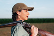 © zorandim75 - Hunter with a rifle on her shoulder.