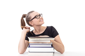 Smiling teen girl with books at table, isolated