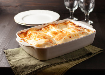 Homemade lasagna in a white bowl