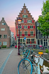 Poster - Medieval crooked facades in the city Amsterdam in the Netherlands