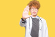 © Krakenimages.com - Young handsome doctor man wearing medical coat doing stop sing with palm of the hand. Warning expression with negative and serious gesture on the face.