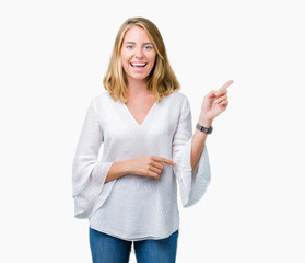 Beautiful young elegant woman over isolated background with a big smile on face, pointing with hand and finger to the side looking at the camera.