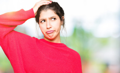 Sticker - Young beautiful woman wearing red sweater and bun confuse and wonder about question. Uncertain with doubt, thinking with hand on head. Pensive concept.