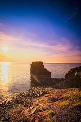 Wall Mural - View of a beach at Bell Island, Newfoundland, Canada during sunset