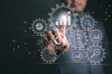 Leinwandbilder - Business data analytics process management with a consultant touching connected gear cogs with KPI financial charts and graph, automated marketing dashboard