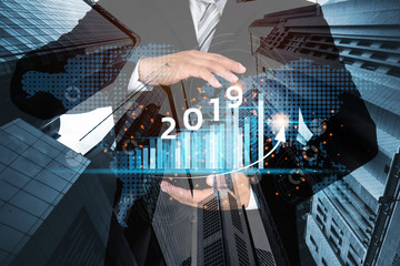 Poster - 2019 New year planning business and financial concept.Man's holding virtual screen with business graph.digital marketing and payment.