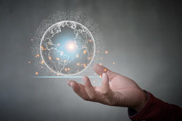 Leinwandbilder - Businessman holding global network and data exchanges over the world.