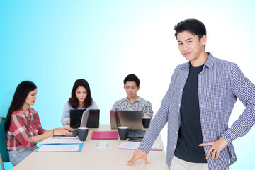 Poster - Asian male entrepreneur stands near his team