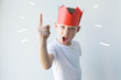 child dictator red paper crown establishes rules