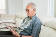 © Creativa Images - Senior man using a digital tablet computer