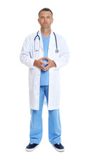 Full Length Portrait Of Experienced Doctor In Uniform On White Background. Medical Service
