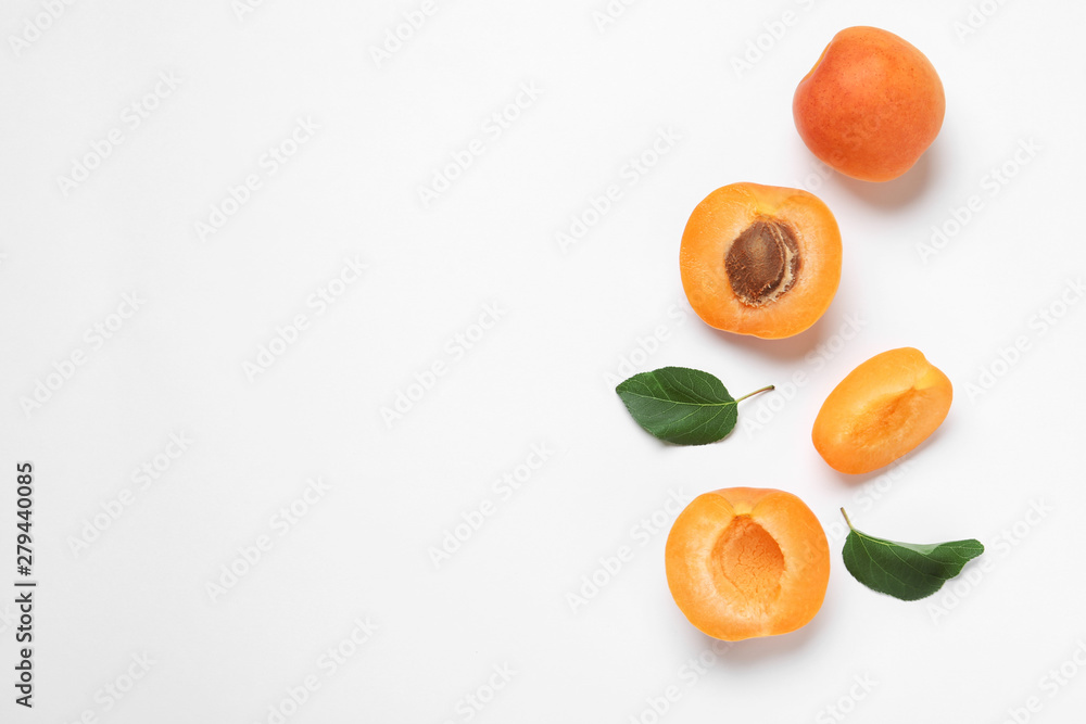 Delicious ripe sweet apricots on white background, top view - obrazy, fototapety, plakaty 