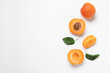 Delicious ripe sweet apricots on white background, top view